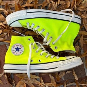 Neon yellow hi-top Converse sneakers